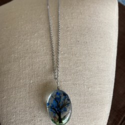 Glass Pendant necklace with dried Flowers inside blue
